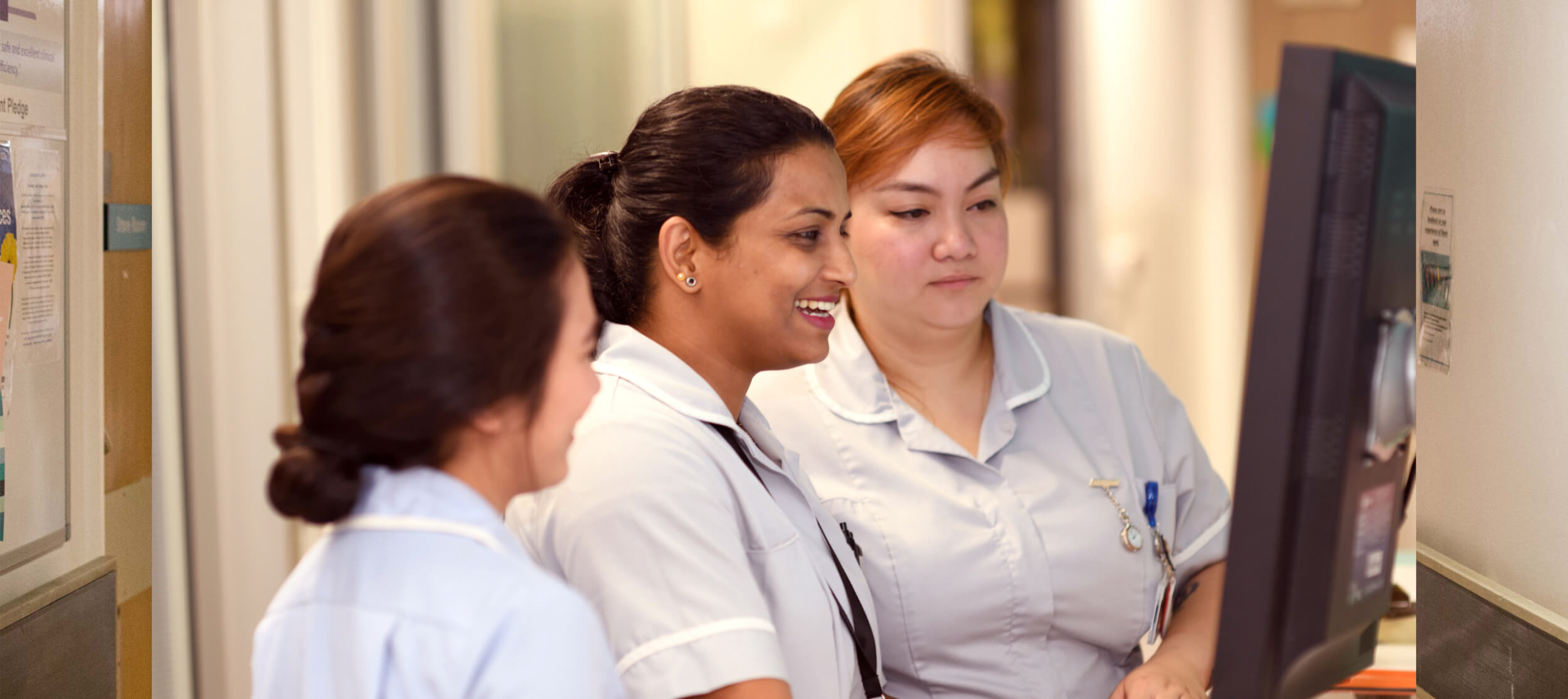 NHS staff looking at a monitor