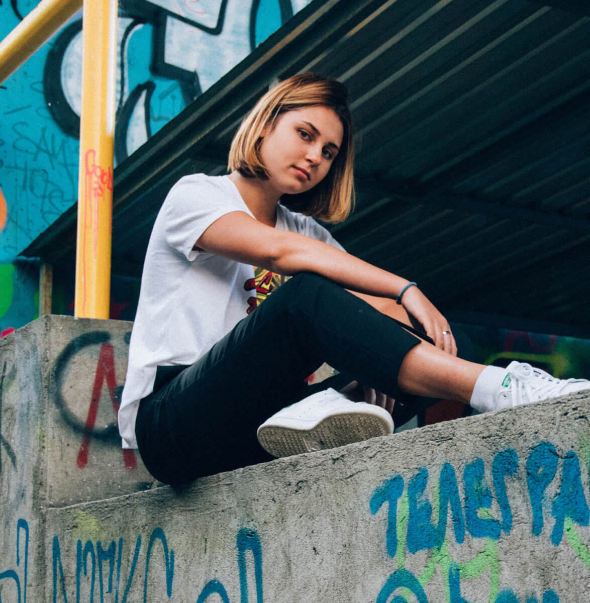 Girl sitting on a wall