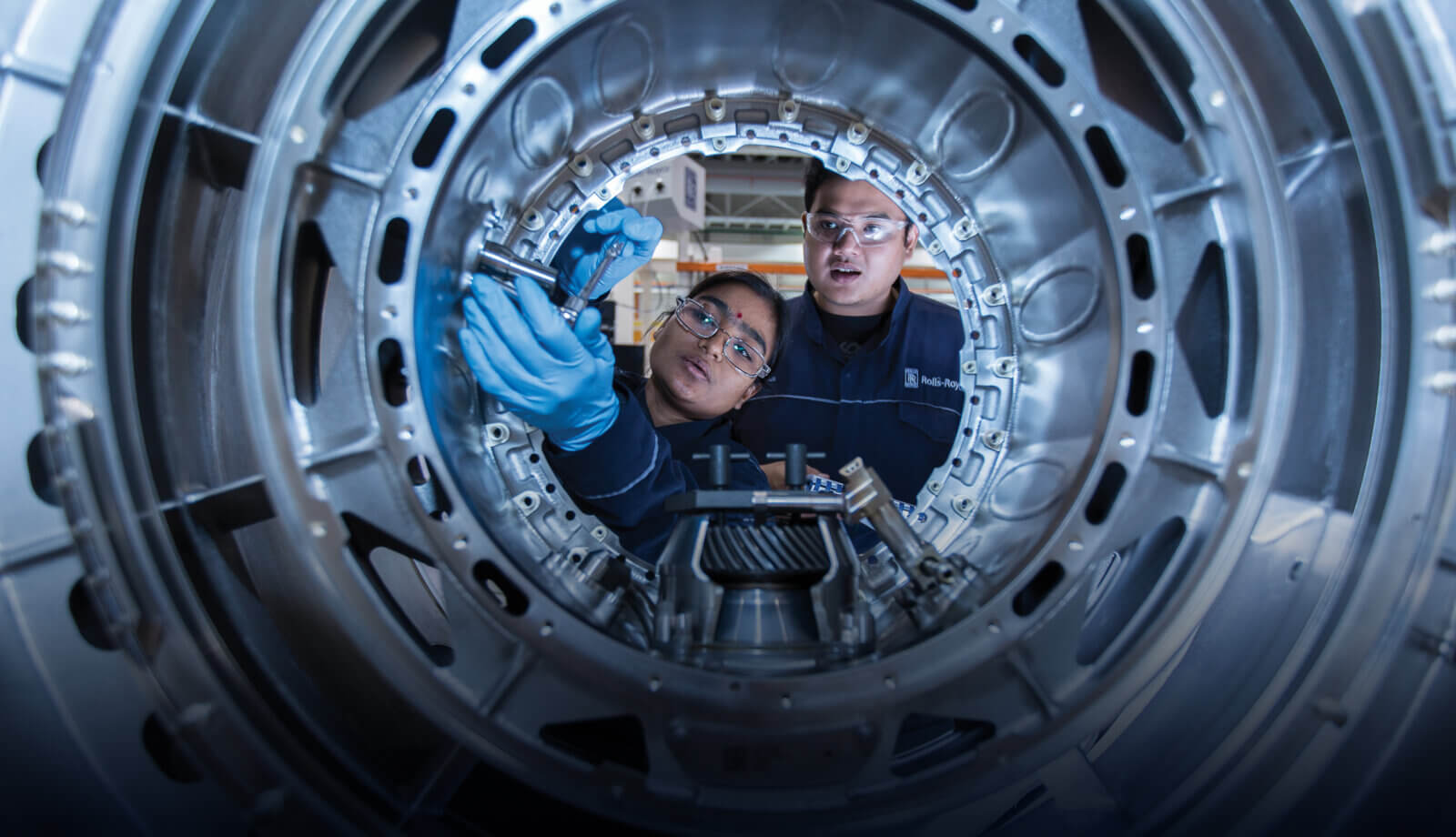 Young engineers examine equipment. Image © Rolls-Royce PLC