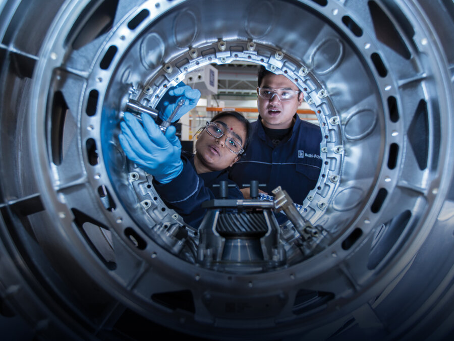 Young engineers examine equipment. Image © Rolls-Royce PLC
